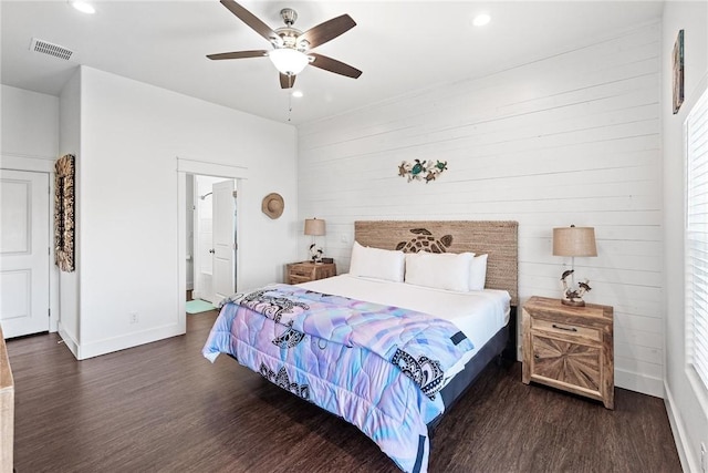 bedroom with baseboards, dark wood finished floors, visible vents, and recessed lighting
