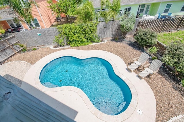 view of pool with a patio area and a fenced backyard