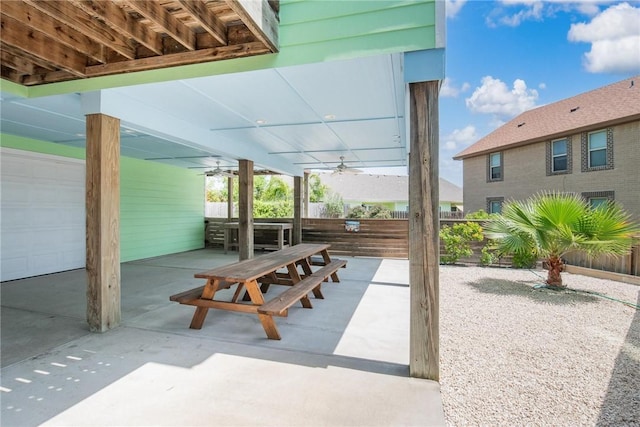 view of patio / terrace featuring ceiling fan, fence, and outdoor dining area