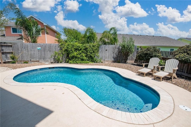 view of swimming pool featuring a fenced in pool, a patio area, and a fenced backyard
