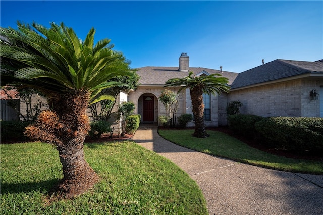 single story home with a front yard