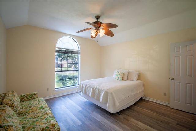 bedroom with lofted ceiling, ceiling fan, and dark hardwood / wood-style flooring