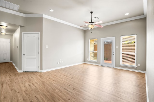 unfurnished room featuring ceiling fan, light wood-type flooring, and crown molding