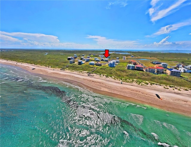 bird's eye view featuring a view of the beach and a water view