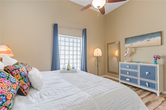 bedroom with wood-type flooring and ceiling fan