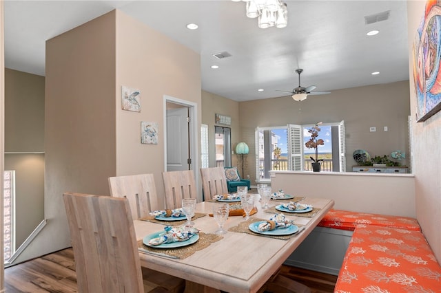 dining area with hardwood / wood-style floors and ceiling fan