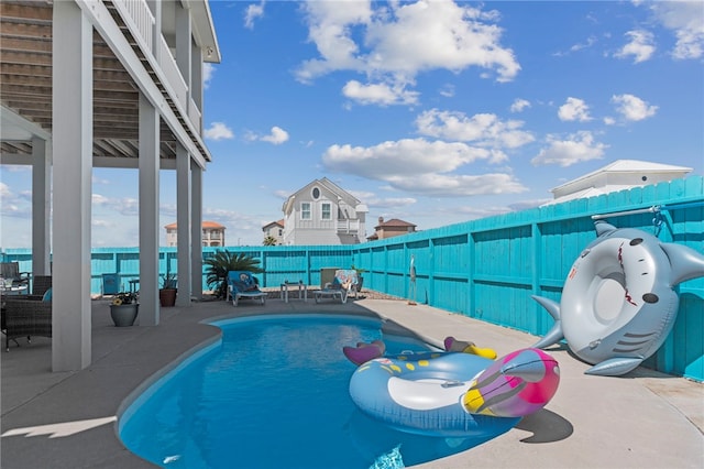 view of swimming pool with a patio area