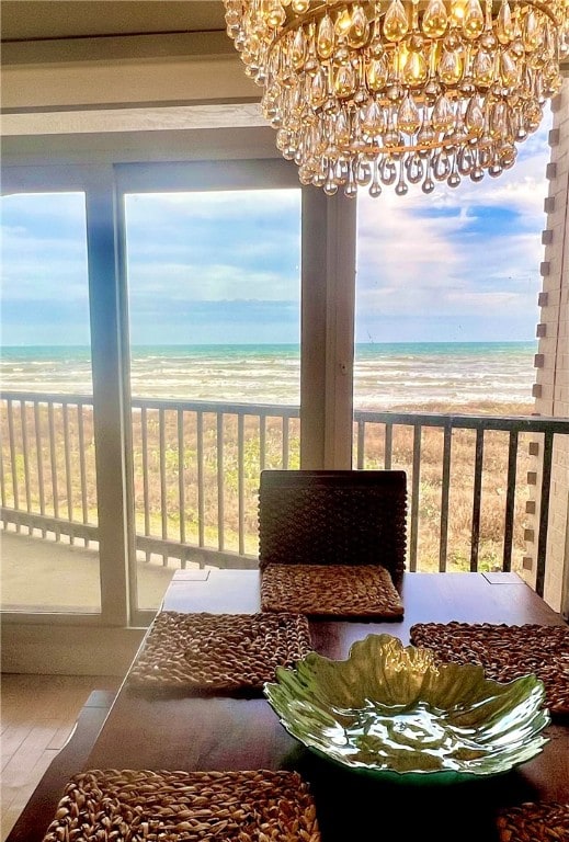 interior space featuring a view of the beach and a water view