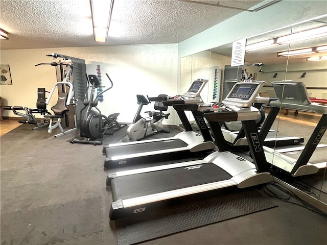 workout area with a textured ceiling