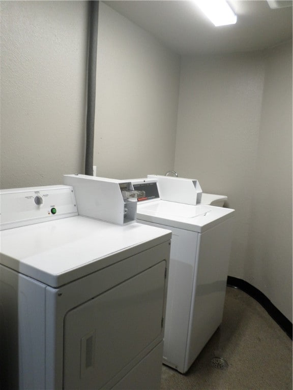 clothes washing area featuring washing machine and clothes dryer