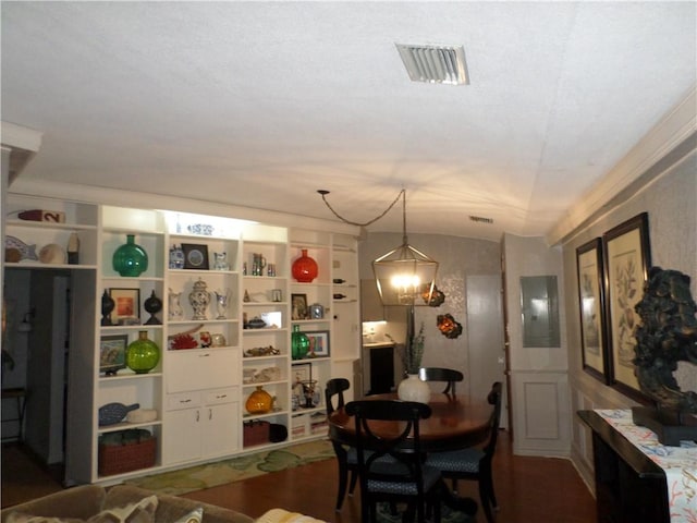 823 S Water St Unit 5C, Corpus Christi, TX 78401 - dining space with vaulted ceiling, electric panel, and wood finished floors