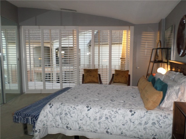 bedroom featuring vaulted ceiling