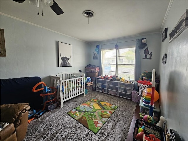 bedroom featuring ornamental molding, a ceiling fan, and visible vents