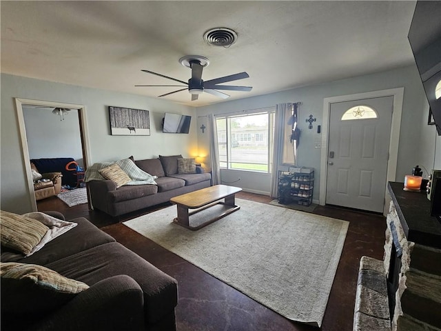 living area with ceiling fan and visible vents