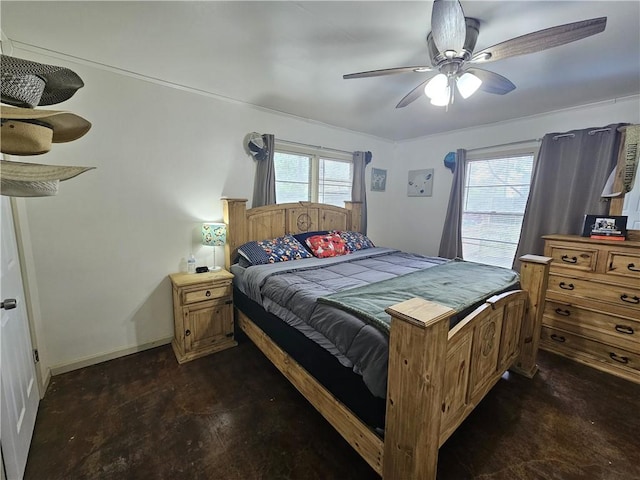 bedroom with baseboards, a ceiling fan, and multiple windows