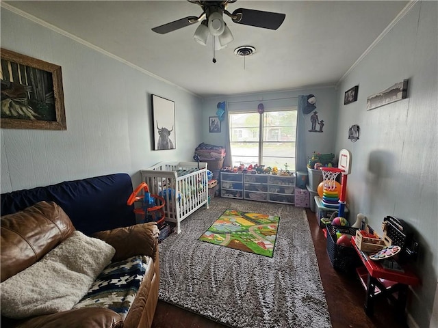 bedroom with visible vents, ornamental molding, and a ceiling fan
