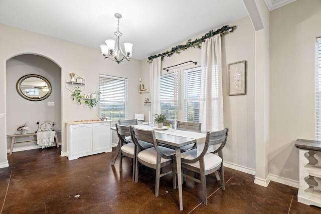 dining area with an inviting chandelier