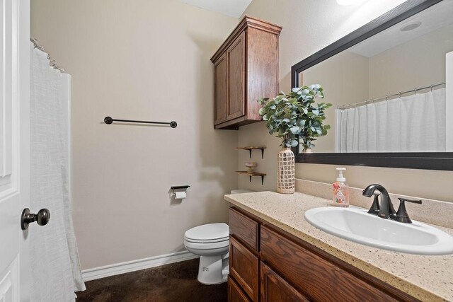 bathroom with vanity and toilet