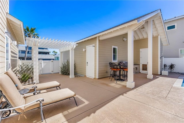 view of patio / terrace featuring fence and a pergola