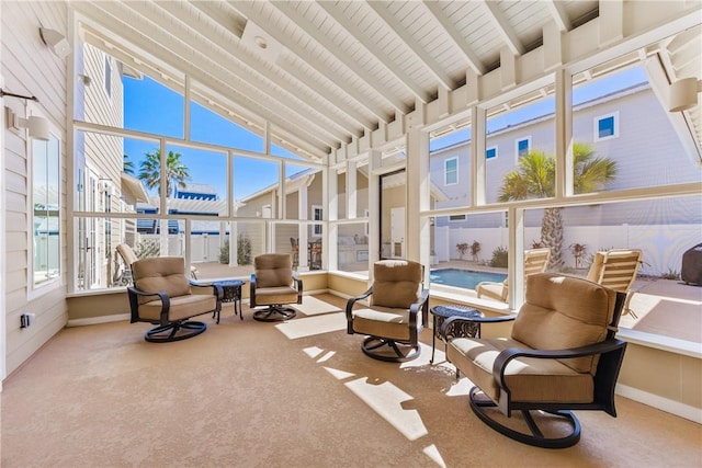 sunroom / solarium with vaulted ceiling with beams and wood ceiling