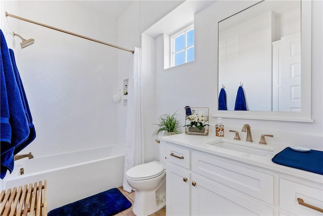 bathroom featuring toilet, vanity, and shower / tub combo