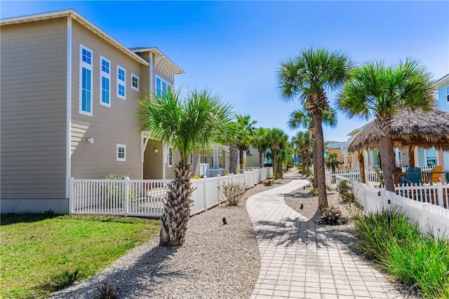 view of property's community featuring a fenced front yard and a residential view