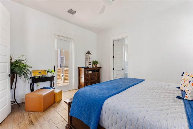 bedroom with visible vents and light wood-type flooring