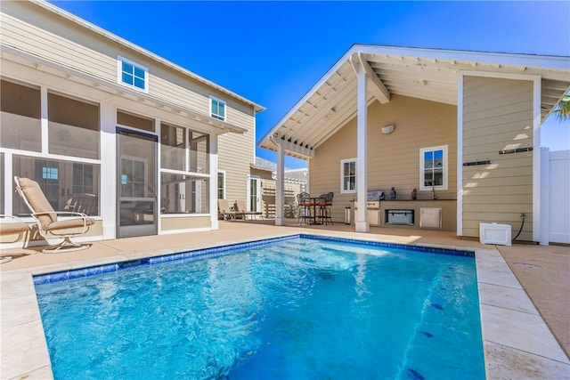 view of swimming pool featuring a fenced in pool, a patio, and a sunroom