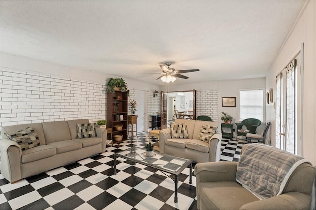 1313 E Cherrystone Dr, Corpus Christi, TX 78412 - living area featuring ceiling fan and brick wall