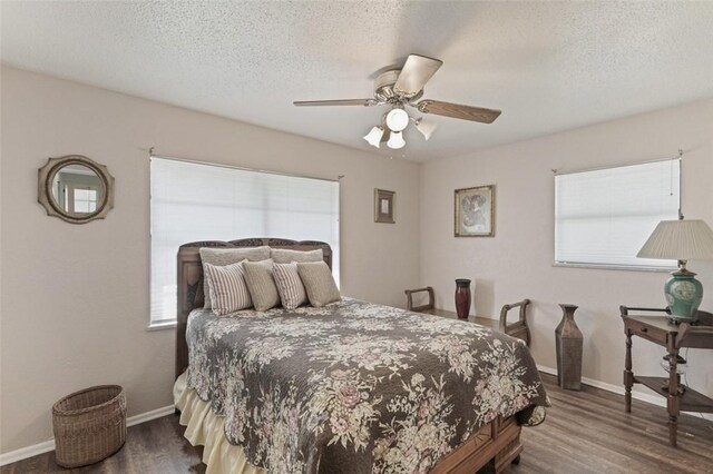 1313 E Cherrystone Dr, Corpus Christi, TX 78412 - bedroom featuring dark wood-style floors, a textured ceiling, and ceiling fan