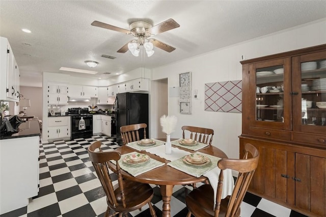 1313 E Cherrystone Dr, Corpus Christi, TX 78412 - dining room featuring tile patterned floors, ceiling fan, and a textured ceiling