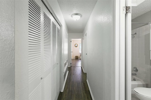 1313 E Cherrystone Dr, Corpus Christi, TX 78412 - corridor with a textured ceiling and dark wood finished floors