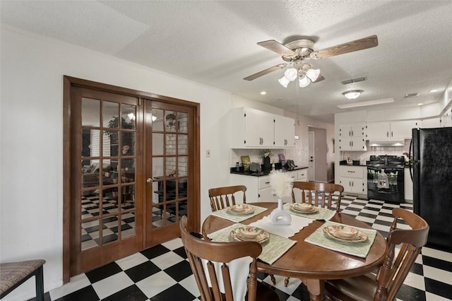 1313 E Cherrystone Dr, Corpus Christi, TX 78412 - dining area with light floors, ceiling fan, french doors, and a textured ceiling