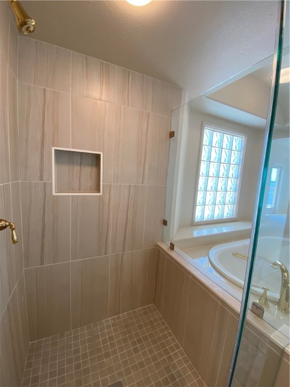 bathroom with shower with separate bathtub