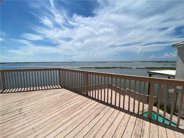 wooden deck with a water view