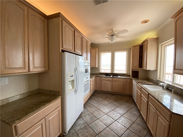 kitchen with sink, ornamental molding, ceiling fan, light brown cabinets, and white appliances