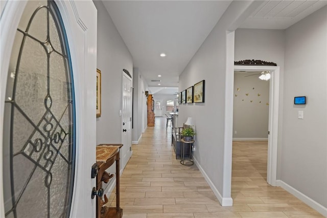 13950 Ketch St, Corpus Christi, TX 78418 - hallway with light wood-style flooring, baseboards, and recessed lighting