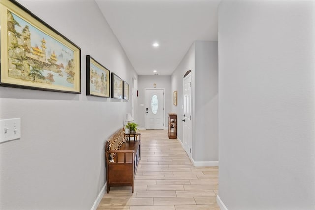 13950 Ketch St, Corpus Christi, TX 78418 - hallway with baseboards, recessed lighting, and wood tiled floors