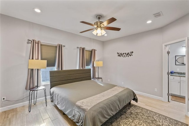 13950 Ketch St, Corpus Christi, TX 78418 - bedroom featuring light wood finished floors, baseboards, recessed lighting, a ceiling fan, and connected bathroom