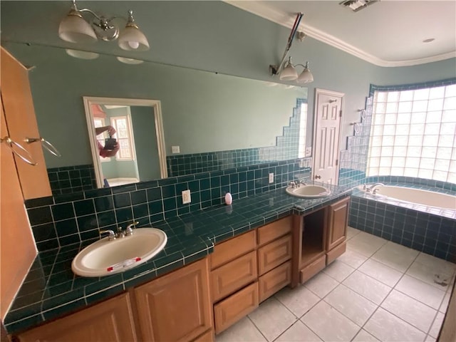 bathroom featuring ornamental molding, tiled bath, tile patterned flooring, and vanity