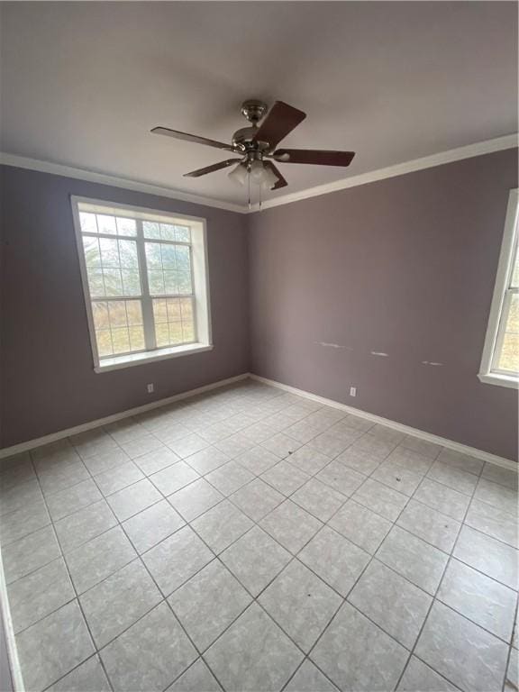 tiled spare room featuring crown molding, ceiling fan, and a wealth of natural light