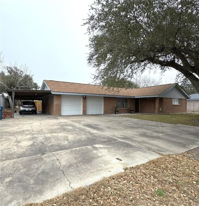 view of front of house with a garage and a carport