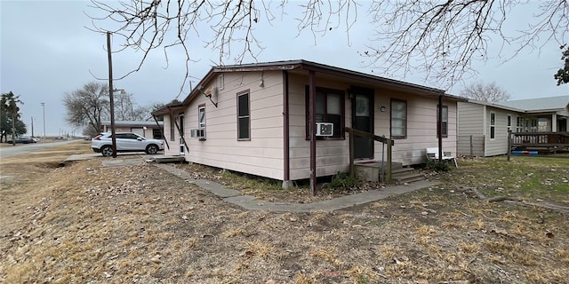 view of side of property featuring cooling unit