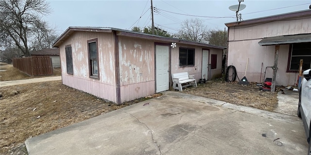 view of property exterior with a patio