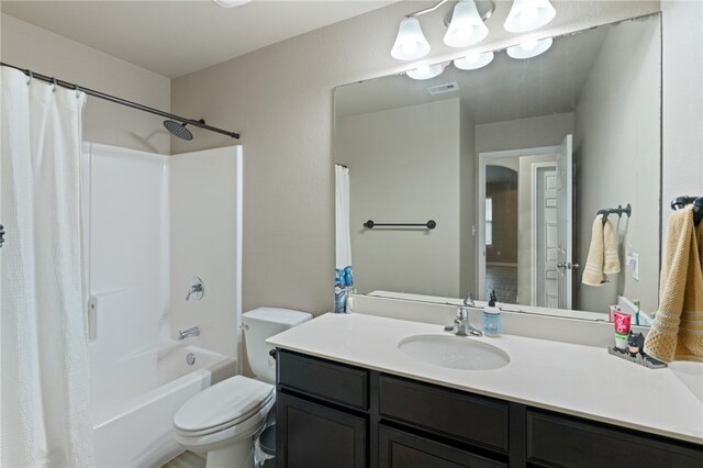 full bathroom with vanity, toilet, and shower / tub combo