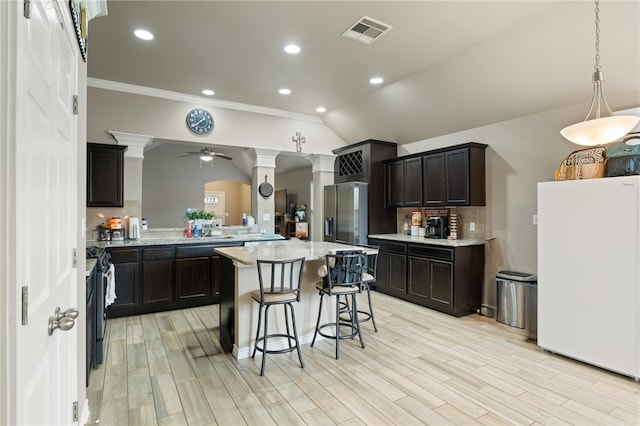 kitchen with white fridge, stainless steel fridge with ice dispenser, ornate columns, lofted ceiling, and ceiling fan