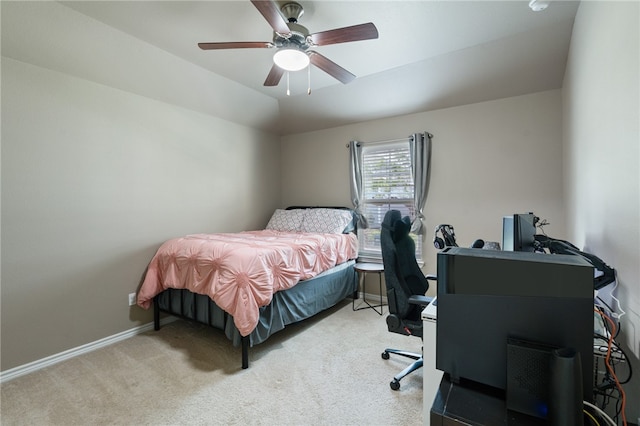 bedroom with ceiling fan and light colored carpet