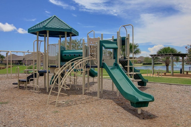 view of jungle gym featuring a water view