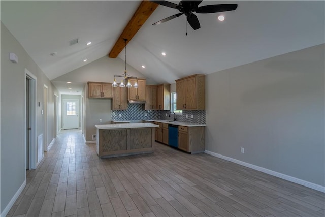 kitchen with backsplash, visible vents, a center island, dishwasher, and ceiling fan with notable chandelier