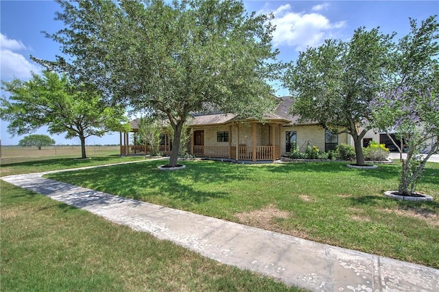 view of front of house with a porch and a front lawn